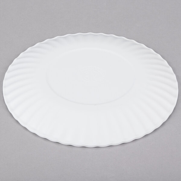 An American Metalcraft Endurance white melamine plate with a rippled edge on a gray surface.