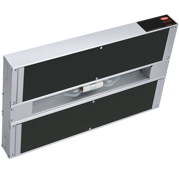 A metal box with two black panels and lights inside.