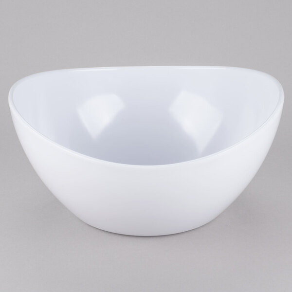 A white GET Osslo melamine bowl with a curved edge on a gray surface.