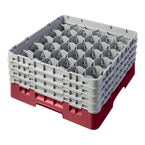 A red and gray plastic Cambro glass rack with extenders.