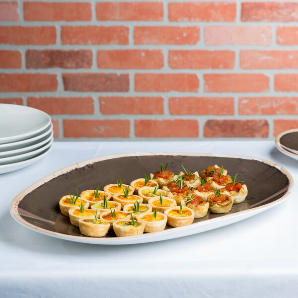 A white melamine platter with a plate of food on a table.