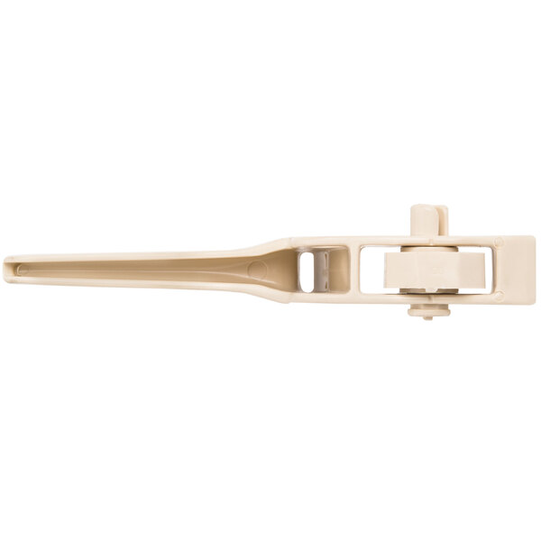 A close up of a beige plastic clip.