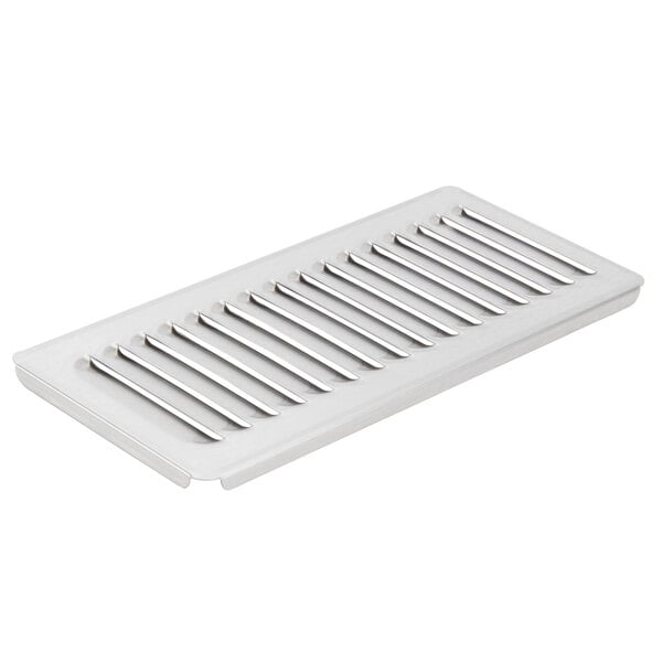 A white plastic drip tray grid with metal slats.