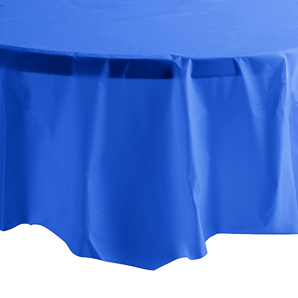 A blue tablecloth with a white table top.