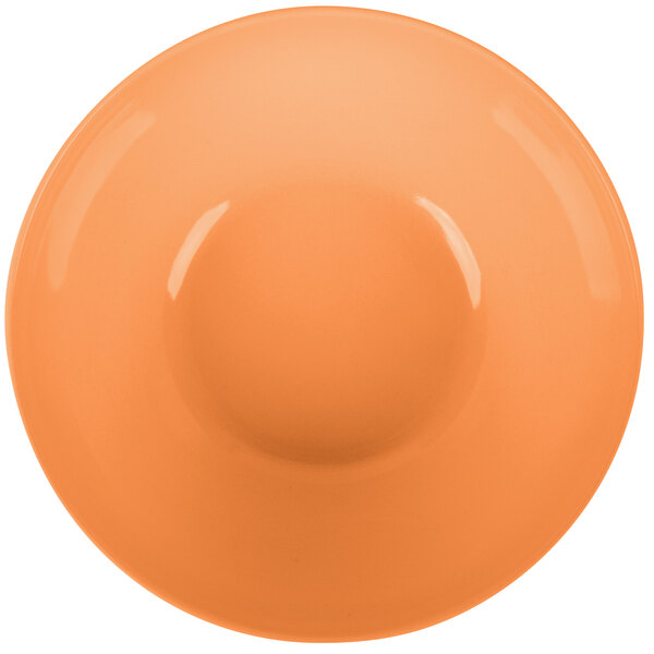 A close-up of a round bamboo salad bowl with an orange finish.