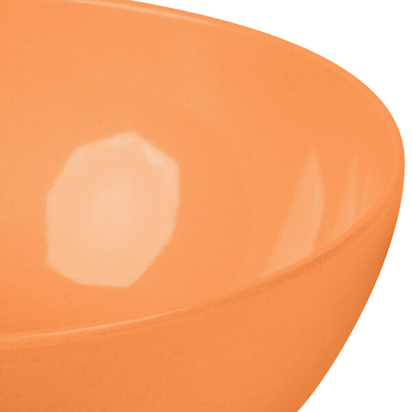 A round orange bamboo salad bowl.