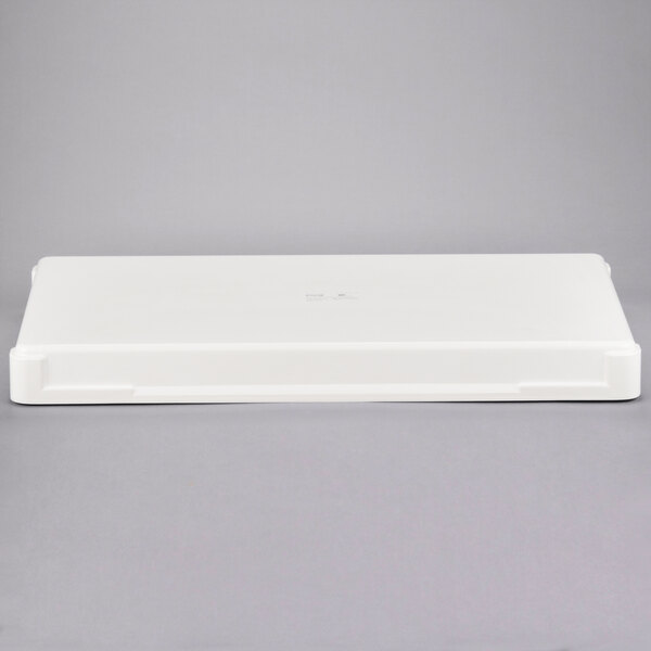 A white rectangular fiberglass dough proofing box.