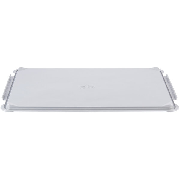 A white rectangular MFG Tray fiberglass lid with two handles.