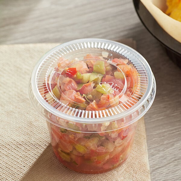 A plastic lid on a bowl of food.