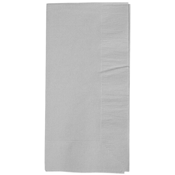 A close-up of a folded white Creative Converting paper dinner napkin with a shimmering silver edge.