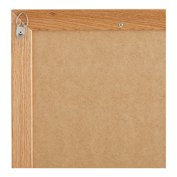 A black felt open face message board with a wooden frame.