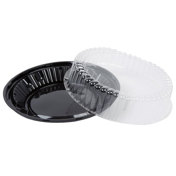 A D&W Fine Pack black plastic pie container with a clear lid.