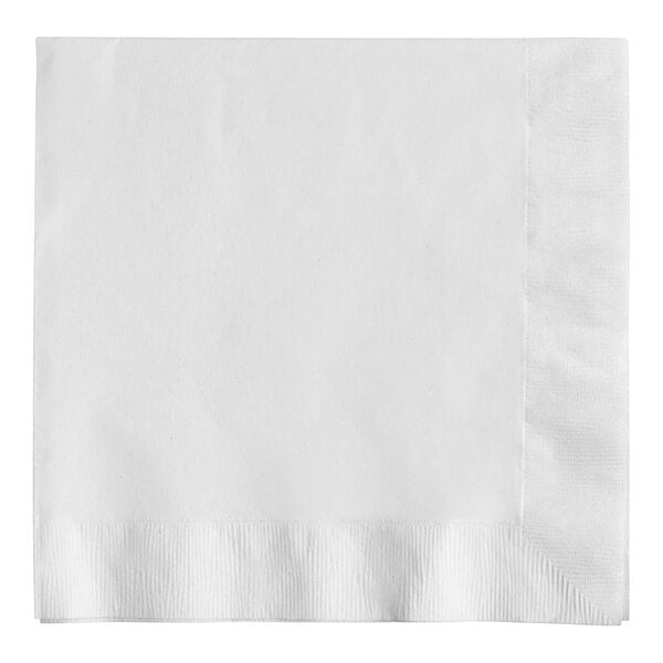 A white Creative Converting paper dinner napkin with a corner edge.