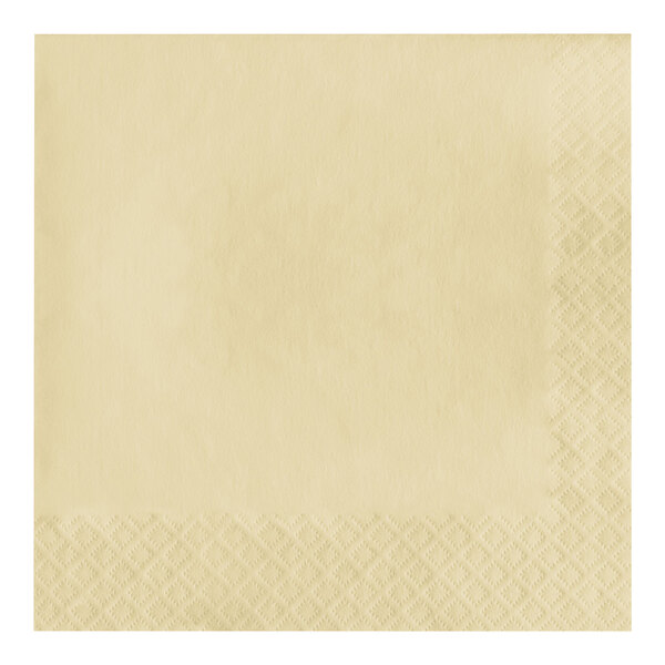 A close-up of a Creative Converting ivory paper napkin with a 1/4 fold pattern.