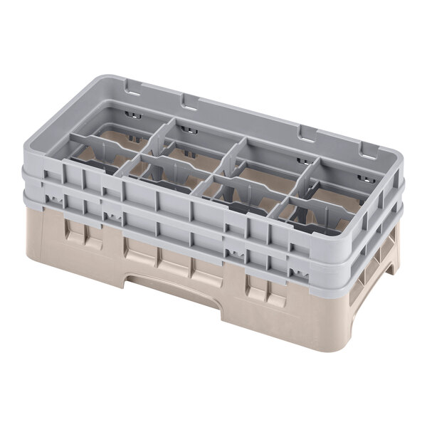 A beige plastic Cambro rack with 8 compartments and 2 extenders with holes in it.