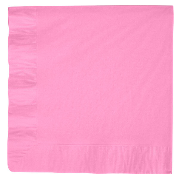 A pink Creative Converting paper dinner napkin with a white border.