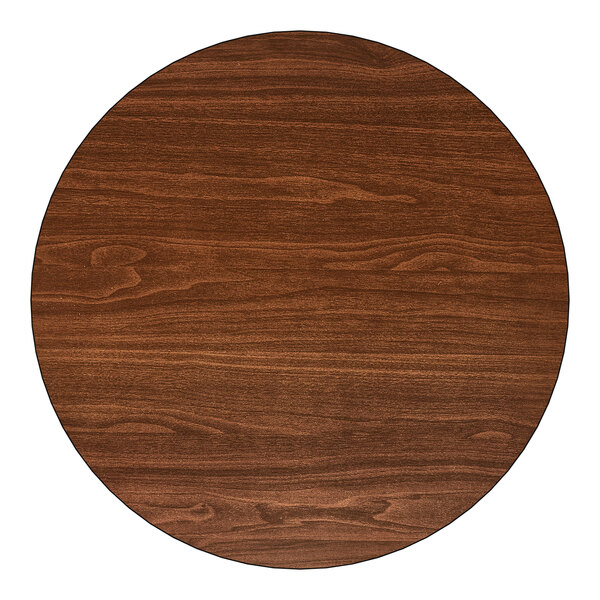 A 24-inch round laminated table top with a reversible walnut and oak finish.