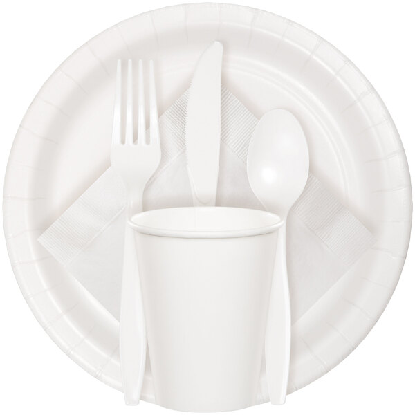 A white Creative Converting paper plate with a fork, spoon, and knife.