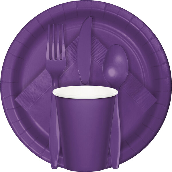 A Creative Converting amethyst purple paper plate with silverware on it.