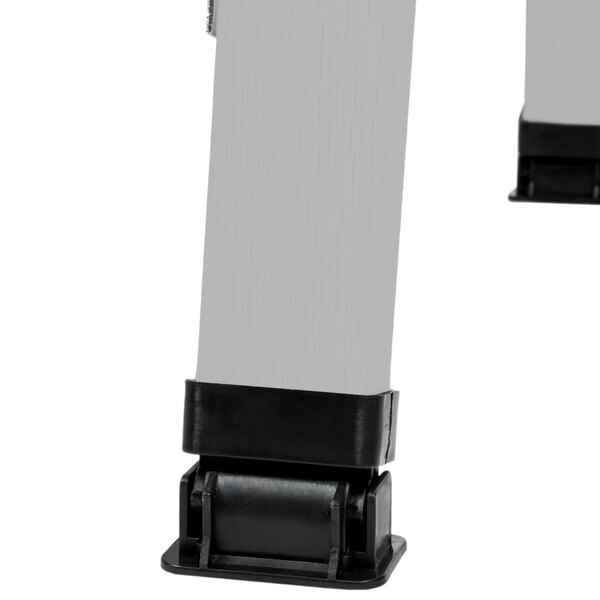 The black and silver metal legs of an Aarco Aluminum Narrow A-Frame Sign Board on a white background.