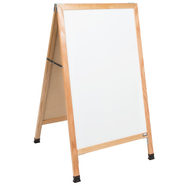 A white porcelain Aarco A-Frame sidewalk board with a wooden frame.