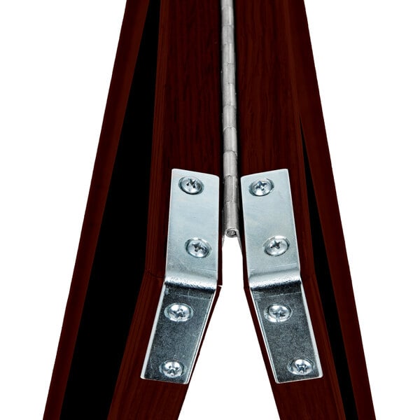 A close-up of a wood frame with metal corners.