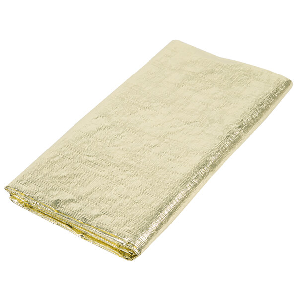 A folded gold metallic plastic table cover.