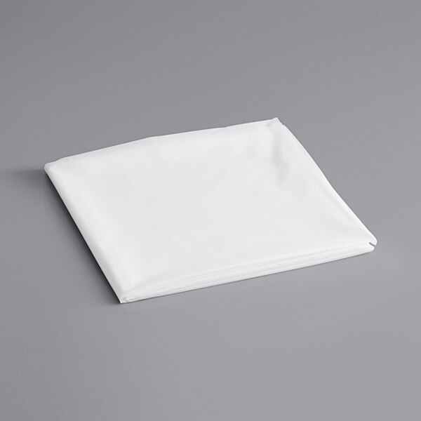A clear plastic table cover on a gray surface.