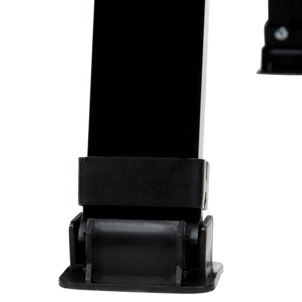 A black rectangular A-Frame with black porcelain boards on black metal legs.