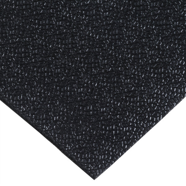 A black vinyl carpet protection mat.