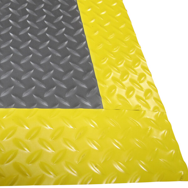 A yellow and grey Cactus Mat Diamond-Dekplate with yellow safety edges.