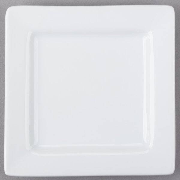 A white square porcelain plate with a wide rim.