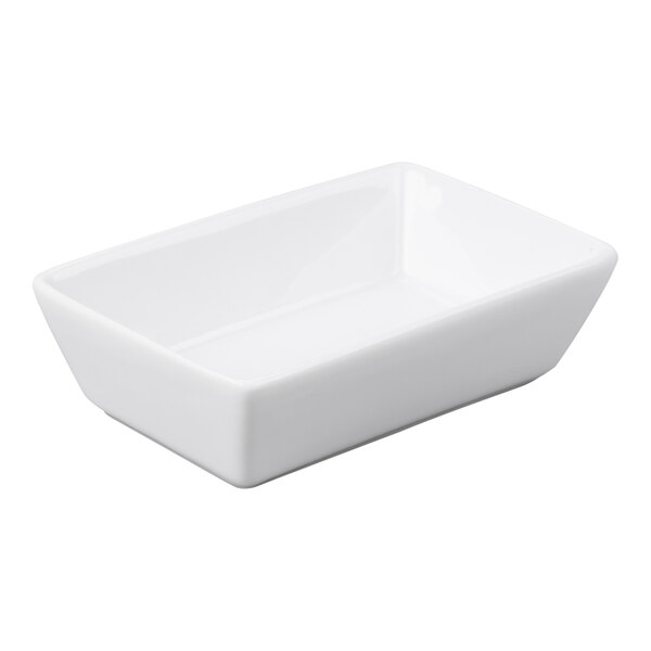 A small, rectangular, ultra bright white porcelain sauce bowl.