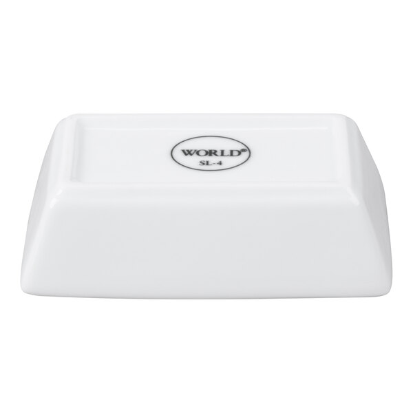 A small, rectangular, ultra bright white porcelain sauce bowl.