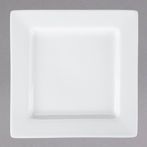 A Libbey white porcelain square plate with a wide white border.