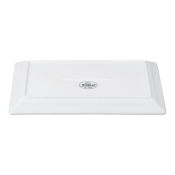 A rectangular white porcelain plate with a wide rim and embossed detailing.