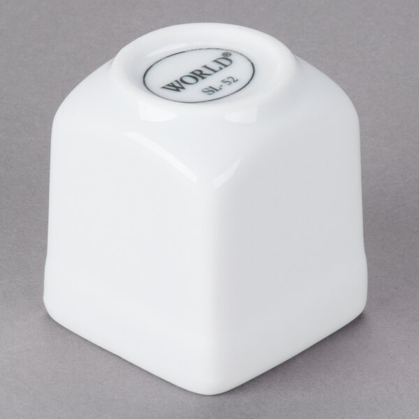 A white square Libbey porcelain sampler cube with a black logo.