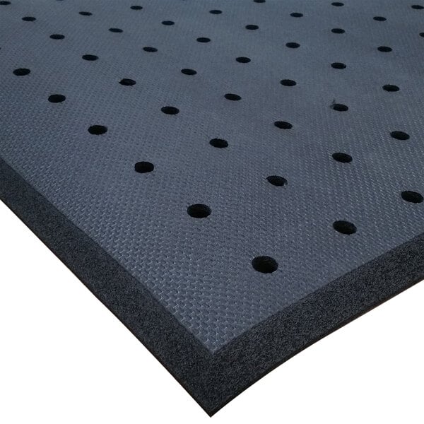 A black Cactus Mat roll with drainage holes.