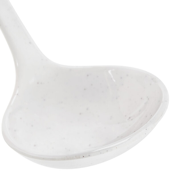 A white Thunder Group Blue Bamboo soup ladle with speckled specks.