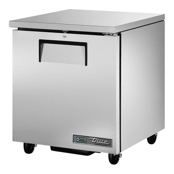 A silver True undercounter refrigerator with wheels.