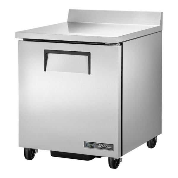 A silver True worktop freezer with a left-hinged door on wheels.