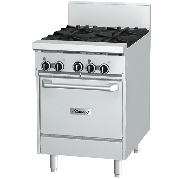 A white stainless steel Garland commercial gas range with black knobs.