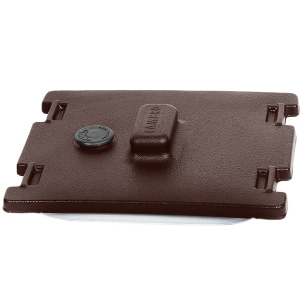 A brown plastic Cambro lid with a black button.