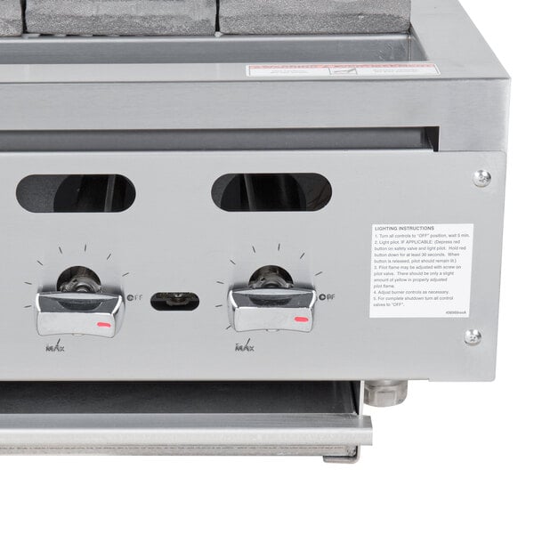 A Vulcan natural gas charbroiler with three burners on a counter.