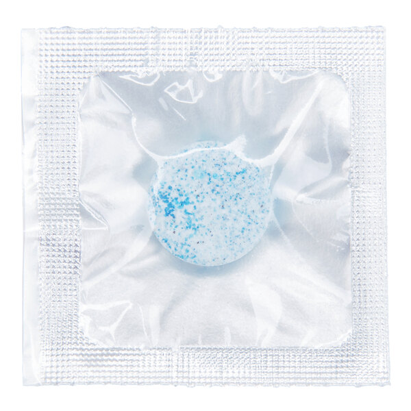 A single blue and white speckled glass cleaner concentrate tablet in a sealed plastic packet.
