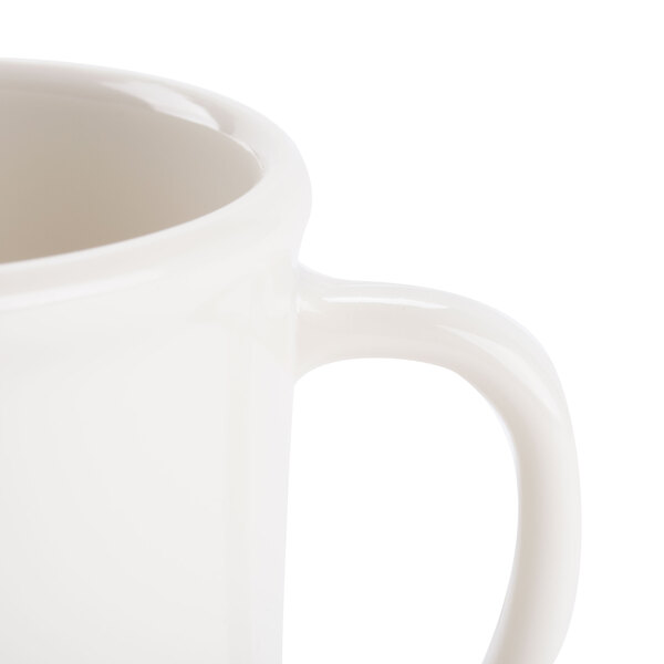 A close-up of a GET Diamond Ivory plastic mug with a handle.