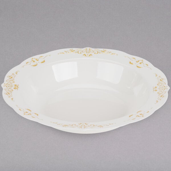 A Fineline Heritage white plastic bowl with gold trim.