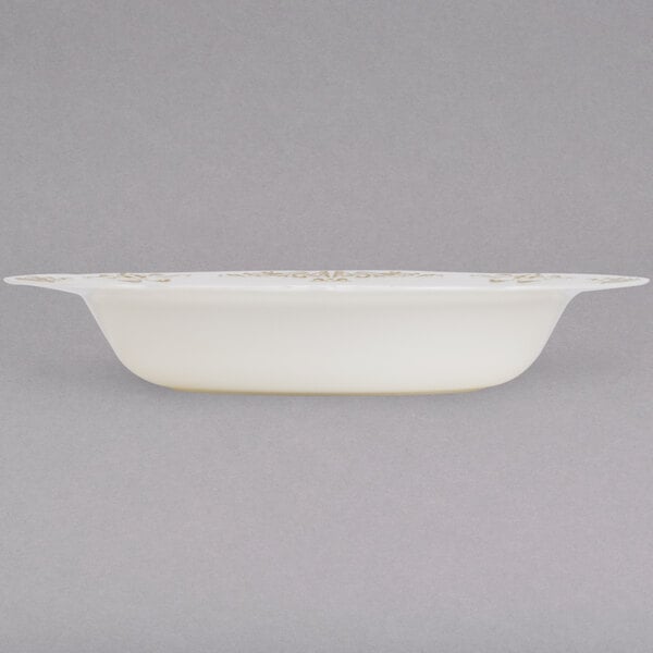 A Fineline Heritage white plastic bowl with gold trim.