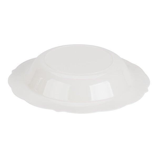 A white plastic bowl with a scalloped edge, shown upside down.