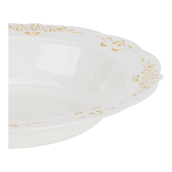 A partial view of a white bowl with gold decorative trim along the scalloped rim.